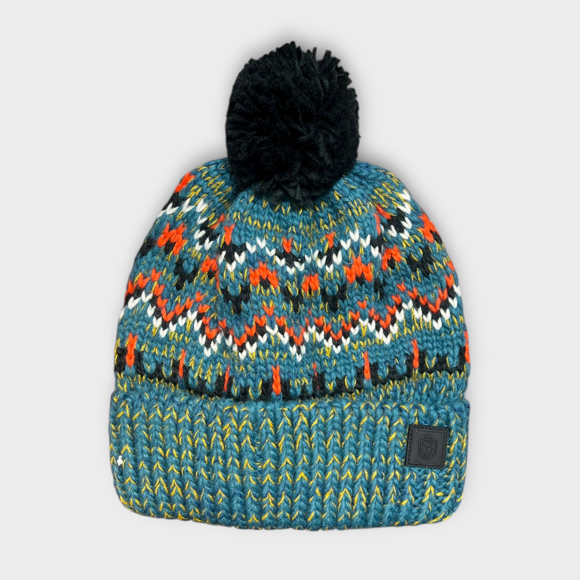 Berretto Con Risvolto E Con Pon Pon Fantasia