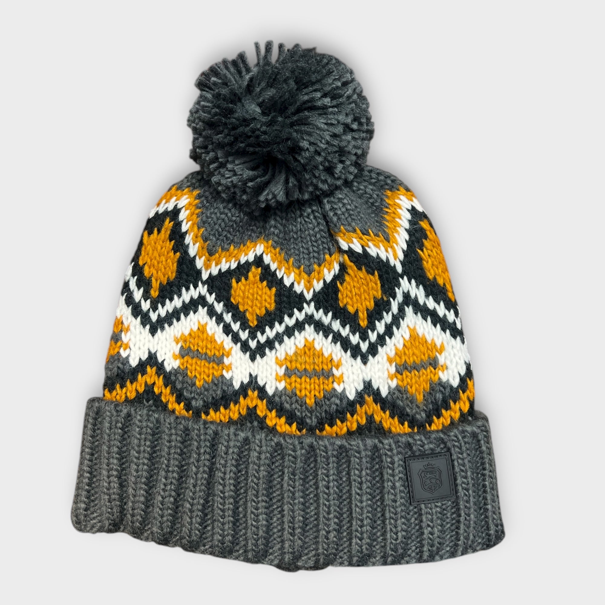 Berretto Con Risvolto E Con Pon Pon Fantasia