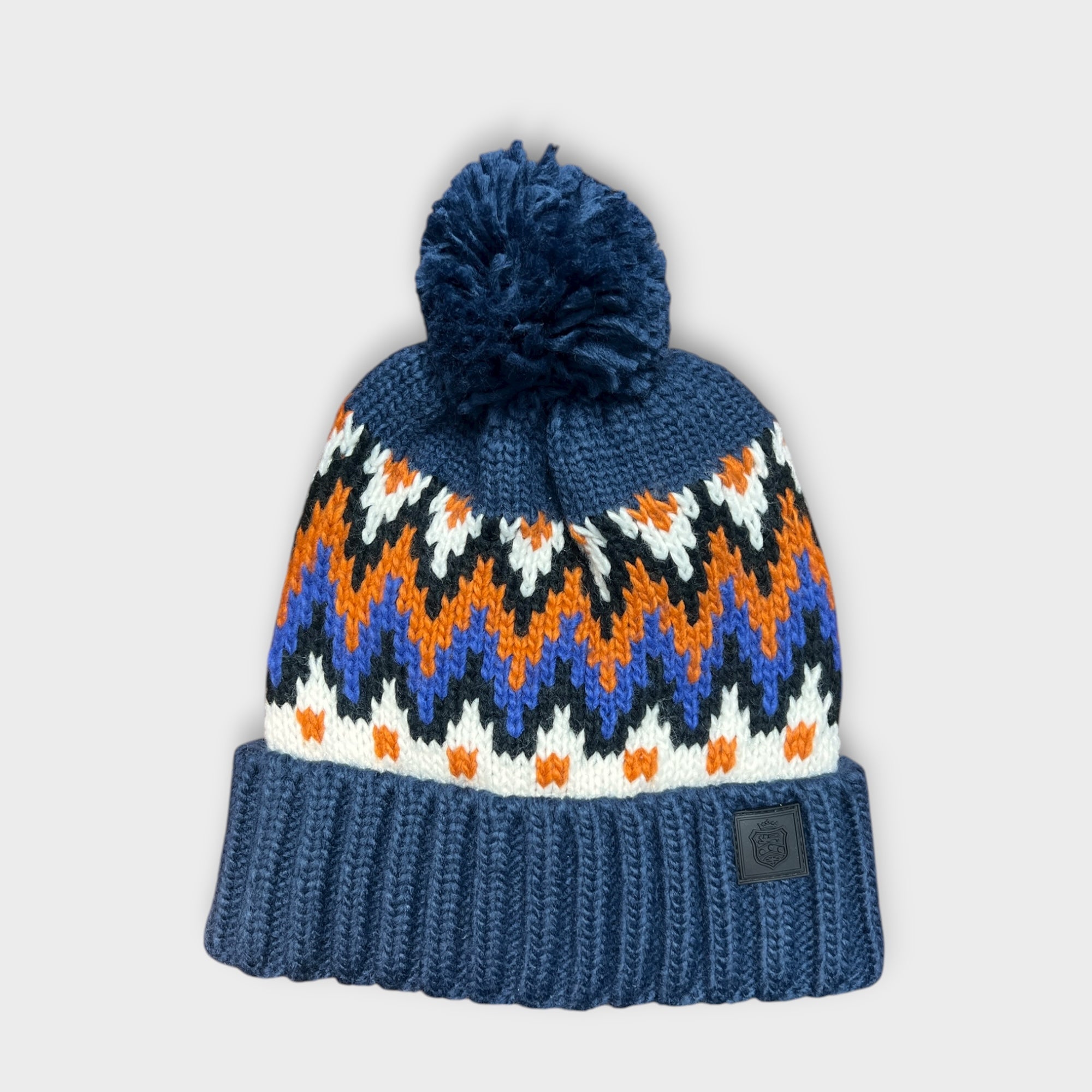 Berretto Con Risvolto E Con Pon Pon Fantasia