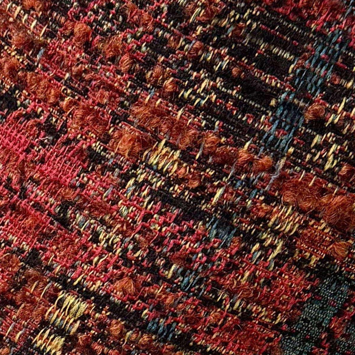 Coppola in Lana Boucle' Color Ruggine e Petrolio