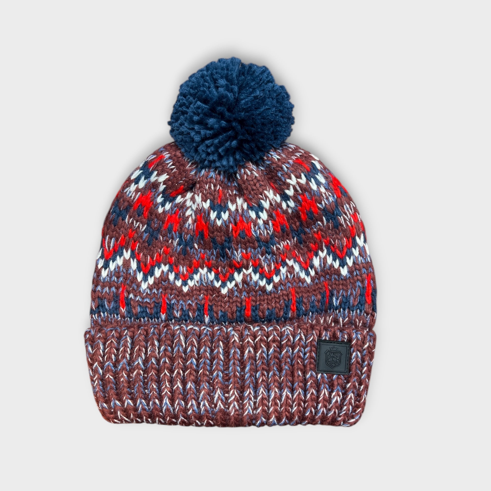 Berretto Con Risvolto E Con Pon Pon Fantasia